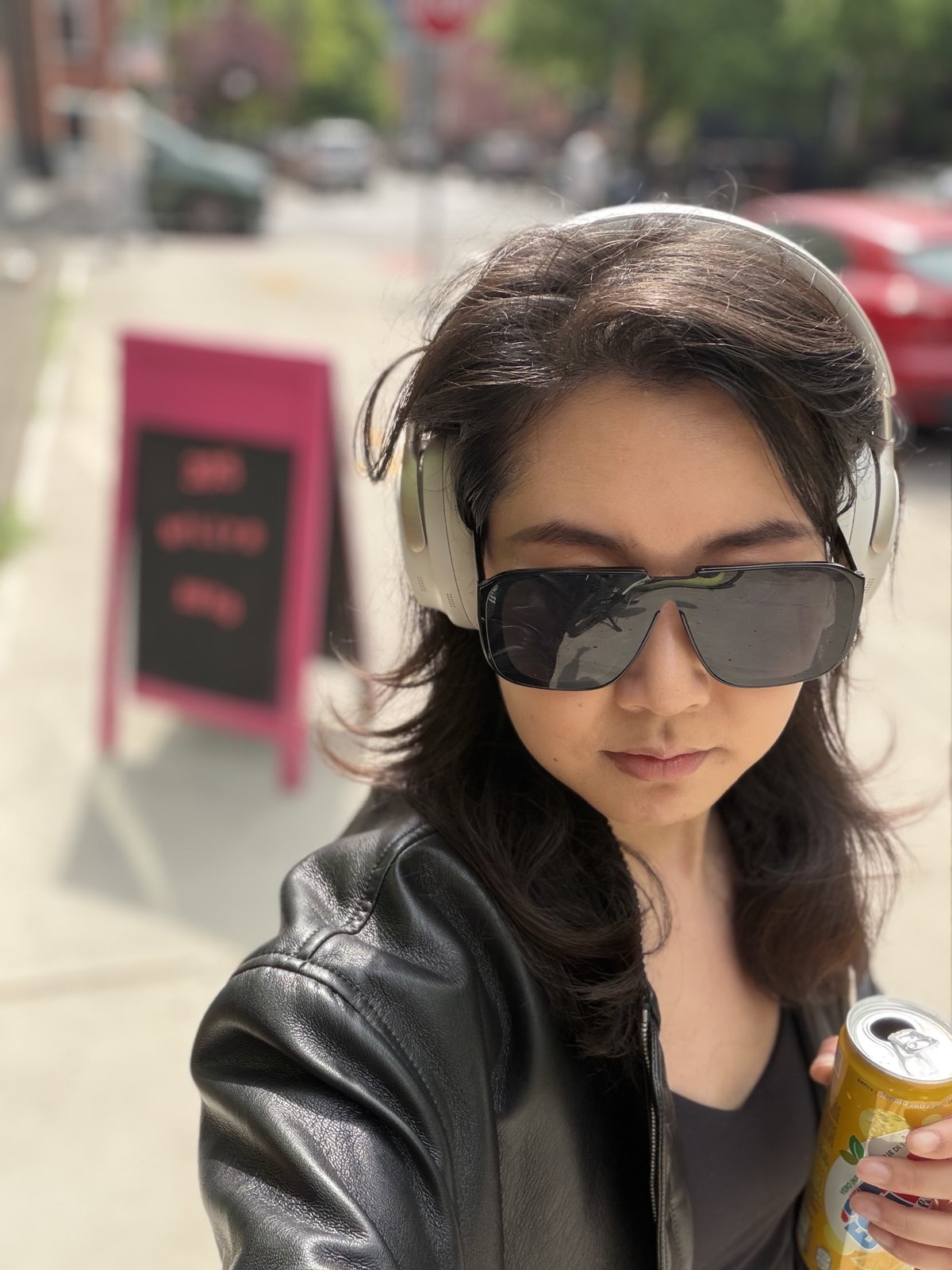Francis Wang wearing headphones and sunglasses outdoors
